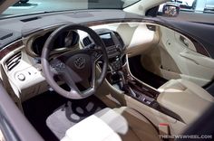 the interior of a car is clean and ready for customers to use it's steering wheel