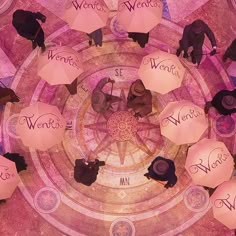 an overhead view of people holding umbrellas with words written on them in the center