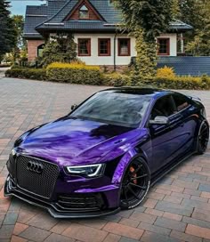 a purple car parked in front of a house
