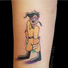 a person with a dog tattoo on their leg