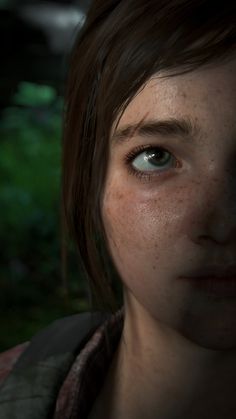 a close up of a person's face with freckles on her eyes