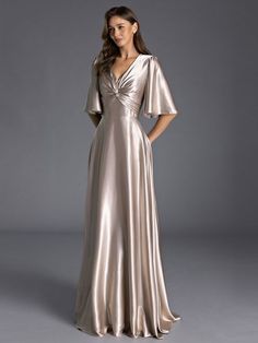 Your dearest supporting friends deserve nothing less than stunning gowns. Our bridesmaid dresses are meticulously crafted by skilled tailors, and the options are extensive. With a palette of over 30 colors to choose from, we cater to regular sizes ranging from 0 to 16 and plus sizes spanning from 14W to 26W. Additionally, we offer the option of custom sizing to ensure a perfect fit. Product Details:Length:Floor-Length;Silhouette:A-line/Princess;Neckline:V-neck;Fabric:Silk Like Satin;Straps Sleeves:1/2 Sleeves;Back Style:Back Zip;Embellishment:Pleated;Fully Lined:Yes;Built In Bra:Yes Satin Gown With Sleeves, Bridesmaids Gowns With Sleeves, Bridesmaid Satin Dresses, Satin Bridesmaids Gowns, Full Sleeve Gowns, Bridesmaid Dresses With Sleeves, Dusty Rose Bridesmaid Dresses, Modest Bridesmaid Dresses, Elegant Dresses Classy