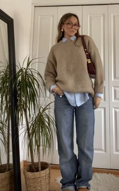 Matching outfit, Uggs, basic jeans, blue Levi's, Levi's jeans, knit top, knit sweater, wool sweater, brown sweater, matching bag, brown leather bag, matching gold jewelry, outfit inspo, style inspo, clean girl outfit aesthetic, gold jewelry, cool girl vibes, Ugg slippers, Ugg, outfit accessories, fall outfit Long Shirt And Sweater Outfit, Minimalist Aesthetic Clothing, T Shirt Sweater Outfit, Brown Travel Outfit, Nice Sweater Outfits, Style Cable Knit Sweater, Relaxed Fit Fall Sweater For Campus, Professional Streetwear, White Button Down With Sweater