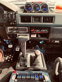 the interior of a car with various gauges and controls