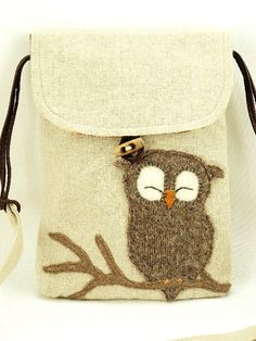 a small purse with an owl on it