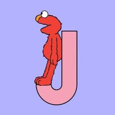 the letter j with an image of a red bird perched on it's head