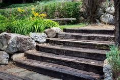 the steps are made of wood and have stone treads that lead up to them