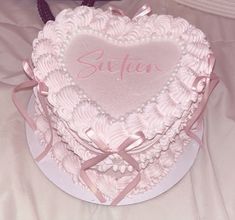 a heart shaped cake with the word sister on it