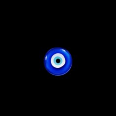 an evil eyeball in the dark with only one eye visible for all to see