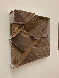 two pieces of cardboard are stacked on top of each other