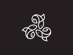 three fish swimming together in the ocean, one is black and white with an abstract design