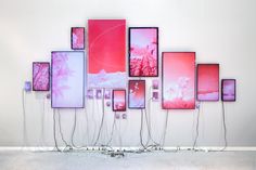an art installation with multiple frames and cords attached to the wall