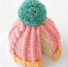 a cake with pink and blue frosting on it