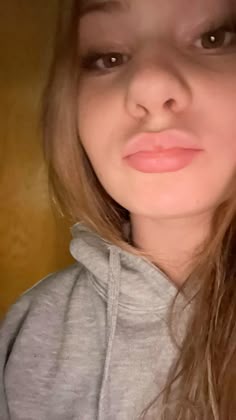 a close up of a person wearing a hoodie