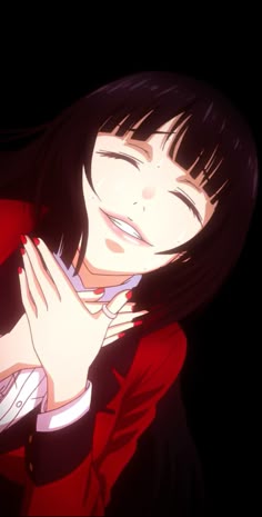 a woman with her eyes closed and hands over her face in front of her chest