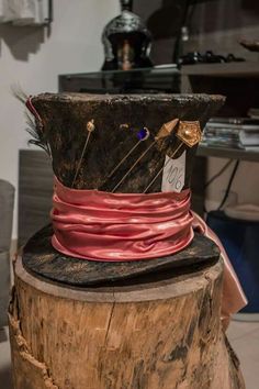 a hat that is sitting on top of a tree stump