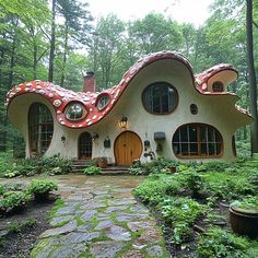a house in the woods with an unusual roof