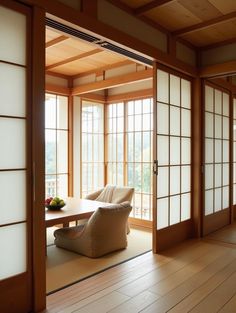 a room with wooden floors and sliding doors