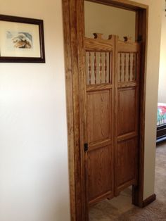an open wooden door in the corner of a room