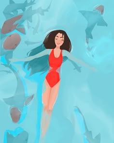 a woman in a red swimsuit floating on top of a body of water surrounded by fish