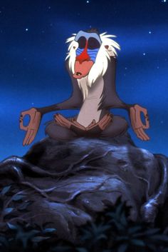 an animated monkey sitting on top of a rock in the middle of the night with his eyes closed