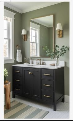 a bathroom with two sinks and a large mirror on the wall over it's vanity