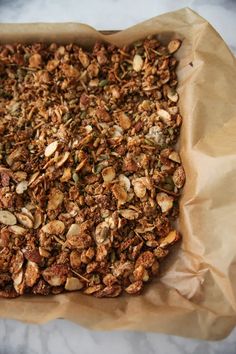 a close up of food on a piece of paper with some sort of granola in it