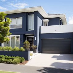 a blue house with white trim on the front and side walls is pictured in this image