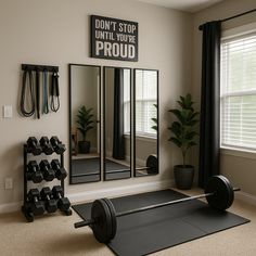 a home gym with mirrors, dumbs and exercise mats