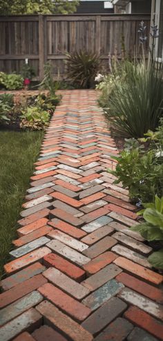 a brick path in the middle of a garden