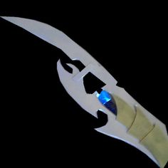 a pair of scissors that are cut in half and have blue stones on the blades