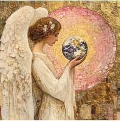 an angel holding a globe in her hands with the earth on it's side