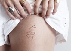 a woman with a tattoo on her thigh
