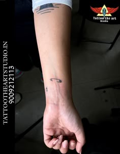 a person with a small wrist tattoo on their left arm and the words, don't