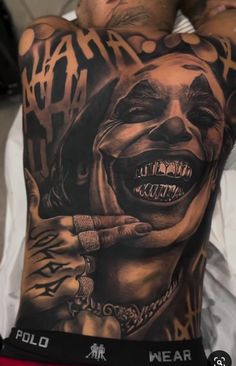 Joker Tattoo Back, Joker Back Tattoo Men, Joker With Grillz Tattoo, Scary Back Tattoos For Guys, Joker Back Tattoo, Joker Stomach Tattoo, Joker Back Piece Tattoo, Joker Laughing Tattoo, Joker Leg Sleeve