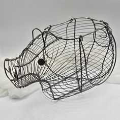 a wire animal head sitting on top of a white surface