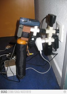 an electrical device is plugged in to the wall with wires and other equipment around it