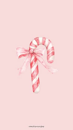 a candy cane with pink and white stripes on it's side, against a pink background
