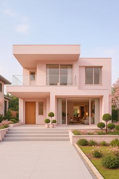 a large pink house with steps leading up to it