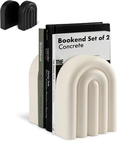 three black and white bookends sitting next to each other