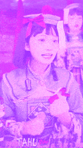a girl in a purple outfit with the word tahu on the bottom right