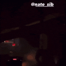 a blurry picture of a person with the name nate sib on the top