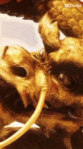 a close up of a statue of a dragon with a caption that says copcut