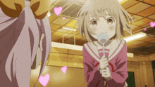 a girl is holding a spoon in her hand and hearts are flying around her