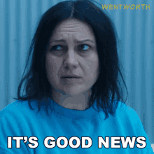 a woman in a blue shirt with the words it 's good news
