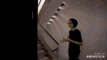 a person is walking up a set of stairs made by animatica