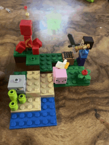 a lego set with a red creeper and steve