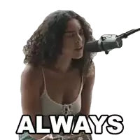 a woman is singing into a microphone and the word always is on the bottom of the picture .
