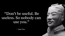 a statue with a quote from sun tzu on it