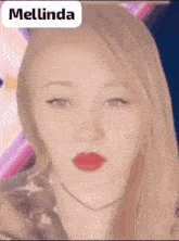 a close up of a woman 's face with the name mellinda written above her